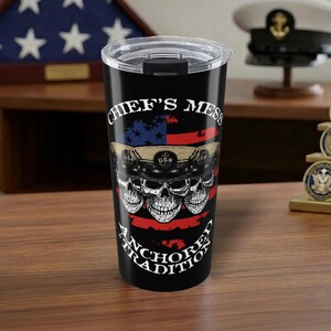 May include: A white ceramic mug with a black handle and the text "But First, Coffee" in a handwritten style. The mug is on a white surface. The mug is 4 inches tall.