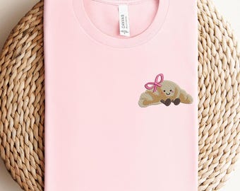 Embroidered Croissant Shirt with Bow, Kawaii Pastry Tee, Food Embroidery, Foodie T-Shirt, French Bakery Gift, Cozy Casual Sweatshirt