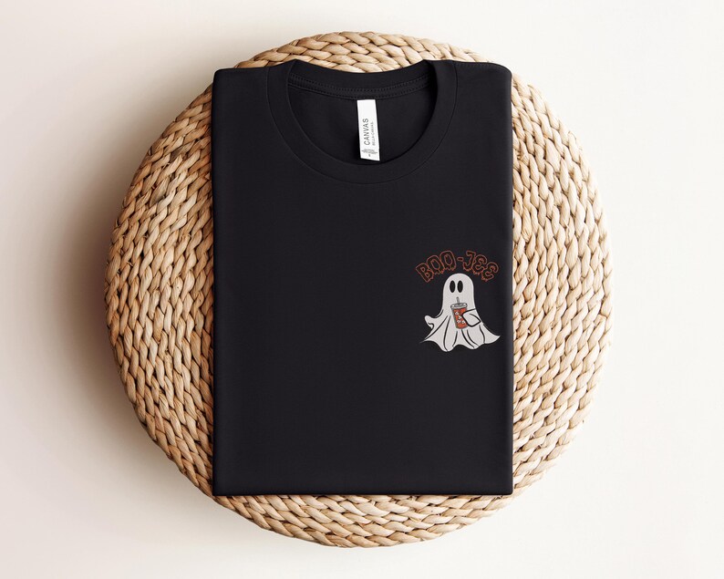 May include: Black t-shirt with a white ghost holding a brown beverage cup and the text "Boo-Jee" in orange.