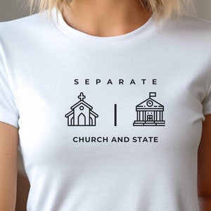 May include: White t-shirt with black text and icons that reads "SEPARATE CHURCH AND STATE". The icons are a church and a government building.