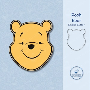 May include: A yellow cookie cutter in the shape of Winnie the Pooh's face, with a black outline and details. The cutter has a smiling expression. The text "Pooh Bear Cookie Cutter" is displayed next to a line drawing of the cutter.