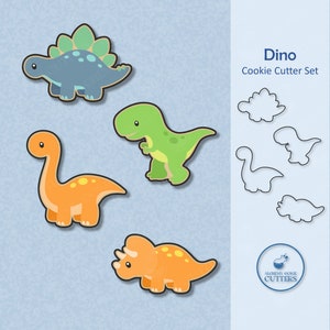 May include: A set of four cookie cutters shaped like dinosaurs. The cutters are in various colors, including green, orange, and blue. The cutters are designed to create cookies in the shape of a stegosaurus, a tyrannosaurus rex, a brachiosaurus, and a triceratops. The text "Dino Cookie Cutter Set" is written in blue text at the top right of the image.