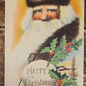 May include: Vintage Christmas postcard featuring Santa Claus with a red hat and white beard. The image includes holly with red berries and the words "Merry Christmas". The background has a soft, warm color palette.
