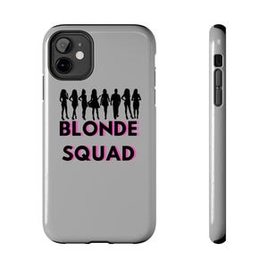 May include: Grey iPhone case with a black silhouette of a group of people and the text "Blonde Squad" in pink and black.
