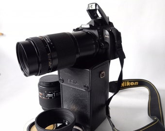 Nikod D40 + 2 battery pack and charger + nikon strap + 8gb memory card + 3x lens filter + lens sun shade