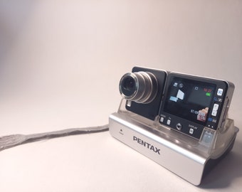 Pentax Optio X + box + cd's + books + cable's + charging station + strap + memory card