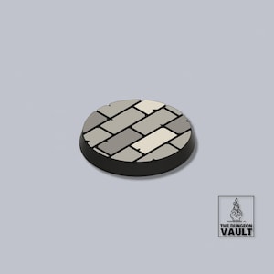 May include: A circular base with a black edge and a cobblestone design in grey and off-white. Suitable for miniature figures, it features The Dungeon Vault logo in the bottom right corner.