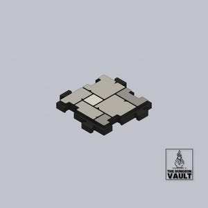 Può includere: Una piastrella modulare per dungeon, renderizzata in 3D, con aspetto simile alla pietra. La piastrella è composta da diversi pezzi grigi e neri ad incastro, creando una superficie strutturata. Il logo The Dungeon Vault si trova in basso a destra.