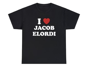 May include: Black t-shirt with the text "I ♥ JACOB ELORDI" in white, with a red heart symbol. The shirt is a classic crew neck style.