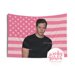 May include: Pink tapestry featuring a portrait of a man in a black shirt against a pink American flag design. The tapestry includes the text "shopdifs.com" and a circular logo that reads "SHOP DILFS only sold on etsy!"