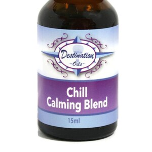 May include: A 15 ml amber glass bottle with a black cap, labeled "Chill Calming Blend" with a compass design and the text "Destination Oils".