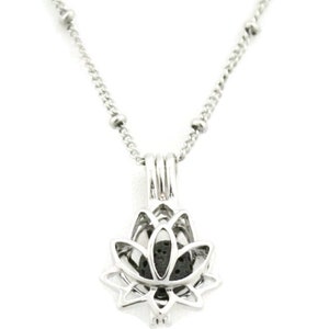May include: A silver chain necklace with a silver lotus flower pendant. The pendant has a small opening to hold essential oils or other small items.