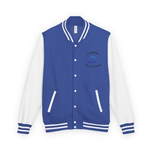 May include: A royal blue varsity jacket with white sleeves and trim. The jacket features a white collar and a snap-button closure. The left chest displays a blue graphic and the text "L'union fait la force."