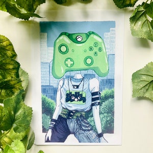 May include: Illustration of a person with a green Xbox controller for a head, set against a cityscape backdrop. The person wears a white tank top with a graphic, black and blue pants, and accessories. The artwork has a modern, urban aesthetic.