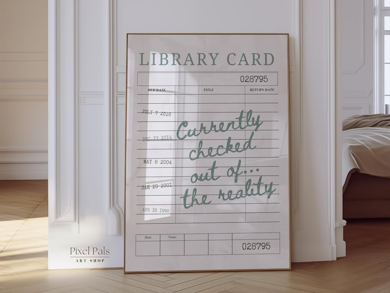 May include: A framed print designed as a library card, with the words "Currently checked out of... the reality" in a handwritten font. The print is set in a brown frame against a white wall, with the text in a light green colour.