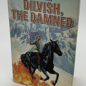May include: A vintage paperback book titled "DILVISH, THE DAMNED" by Roger Zelazny. The cover art shows a man on a black horse amidst flames, with a snowy mountain backdrop. The book is in good condition.
