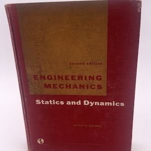 Könnte beinhalten: Ein rotes Hardcover-Buch mit dem Titel "Engineering Mechanics Statics and Dynamics" von Irving H. Shames. Das Buch ist eine zweite Auflage und Teil der Schaum's Outline Series.