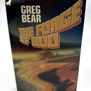 May include: A book cover with a dark background and a swirling orange and yellow design. The title "The Forge of God" is in large, bold, gold letters. The author's name, "Greg Bear", is in smaller white letters above the title.