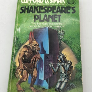 May include: A vintage paperback science fiction novel cover featuring a green, leafy background with a large, brown, furry creature with long claws and a robot in the foreground. The title of the book is "Shakespeare's Planet" by Clifford D. Simak.