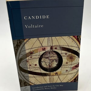 May include: A blue book with the title "CANDIDE" by Voltaire. The cover features an antique illustration of a globe surrounded by celestial bodies.