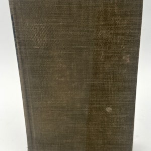 May include: A brown hardback book with a textured cover.