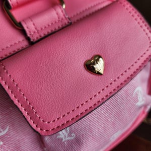 Juicy Couture pink and white lemonade pack it up bowler shoulder bag 2 front pockets accent and printed logo all over the purse image 13