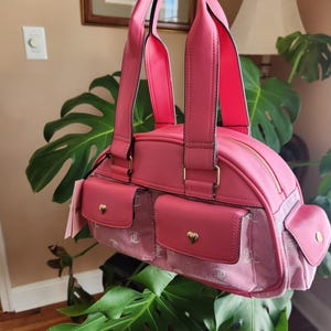 Juicy Couture pink and white lemonade pack it up bowler shoulder bag 2 front pockets accent and printed logo all over the purse image 5