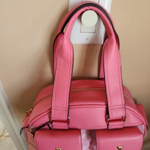 Juicy Couture pink and white lemonade pack it up bowler shoulder bag 2 front pockets accent and printed logo all over the purse image 8
