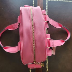 Juicy Couture pink and white lemonade pack it up bowler shoulder bag 2 front pockets accent and printed logo all over the purse image 11