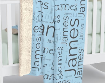 May include: A light blue baby blanket with the name "James" repeated in a word cloud pattern.