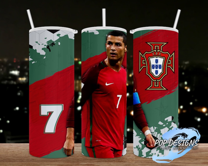 May include: Three stainless steel tumblers with straws. Each tumbler has a different design: a soccer ball graphic, a portrait of a soccer player in a red jersey, and the Portuguese coat of arms. The number 7 is displayed on one tumbler.