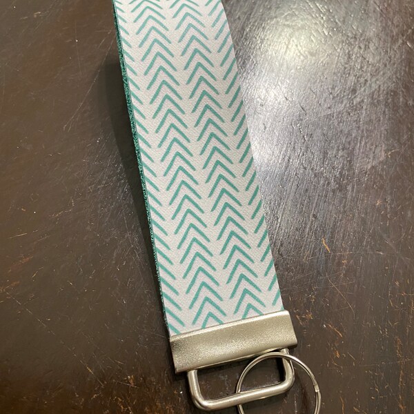 Aqua Arrows Keychain wristlet with gold glitter backing