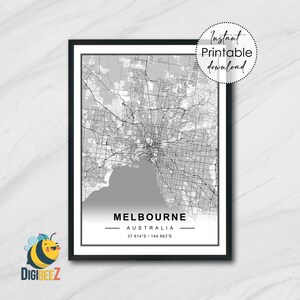 May include: A black framed print featuring a grayscale map of Melbourne, Australia. The city's name is centered at the bottom, with coordinates below. A circular graphic in the upper right corner reads "Instant Printable Download".