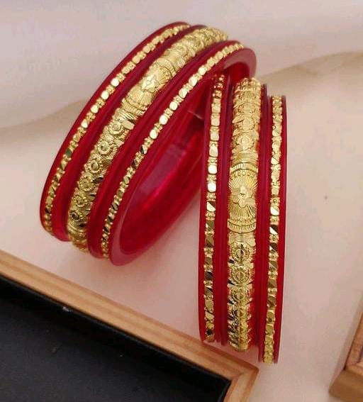 Gold bangles with red plastic discount