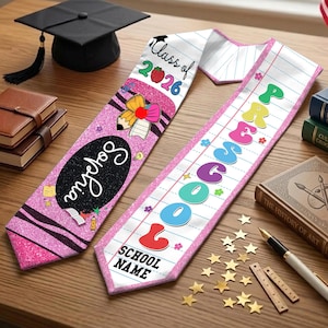 May include: Two graduation sashes with text and graphics, one pink with "Sophia" and "Class of 2026", the other white with "Preschool" and "School Name". A black graduation cap and books are in the background.
