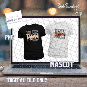 May include: A digital design for a black and white t-shirt with the word "TIGERS" in orange text. The design is displayed on a laptop screen with the words "Shirt/Sweatshirt Design" and "MASCOT" on the screen. The text "*DIGITAL FILE ONLY" is at the bottom of the image.