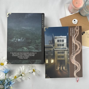 May include: Two hardcover books with decorative covers. One features a landscape with a building, the other a building facade. Text on the covers includes "GRANGER IS THIS REAL?" and a quote about butterfly wings causing a typhoon. Decorative corner accents.