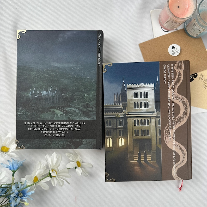 May include: Two hardcover books with decorative covers. One features a landscape with a building, the other a building facade. Text on the covers includes "GRANGER IS THIS REAL?" and a quote about butterfly wings causing a typhoon. Decorative corner accents.