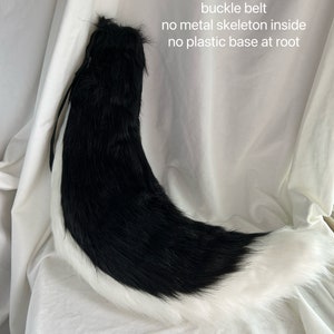 May include: Black and white faux fur tail with a white tip. The tail is 80 inches long and has a buckle belt. It has no metal skeleton inside and no plastic base at the root.