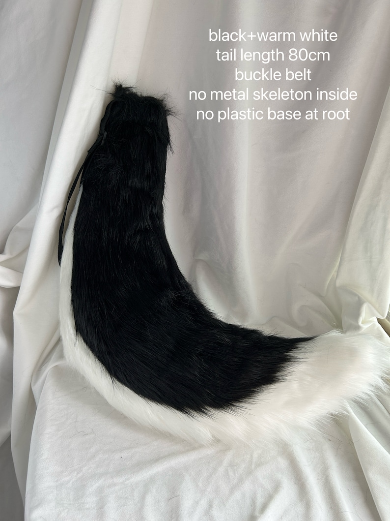 May include: Black and white faux fur tail with a white tip. The tail is 80 inches long and has a buckle belt. It has no metal skeleton inside and no plastic base at the root.
