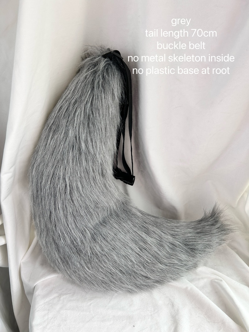 May include: A gray faux fur tail with a black adjustable belt. The tail is 70 inches long and has no metal skeleton or plastic base.