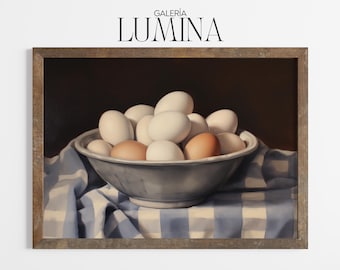 May include: A framed still life painting featuring a gray bowl filled with white and brown eggs. The bowl rests on a blue and white checkered cloth. The painting is set against a dark background, with the text "GALERIA LUMINA" at the top.