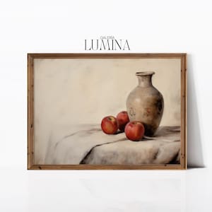 May include: A painting of a still life with a brown ceramic vase and three red apples on a white tablecloth. The painting is framed in a wooden frame.