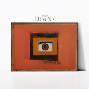 May include: A framed abstract painting with a large eye in the center. The eye is surrounded by a yellow, black, and gray frame. The background is a solid orange color. The painting is titled "Galeria Lumina".