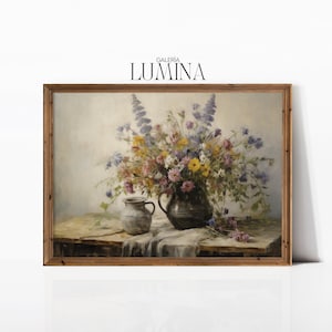 May include: A framed painting of a still life featuring a bouquet of wildflowers in a rustic vase. The flowers are a mix of purple, pink, yellow, and white. The vase is a dark brown color and is sitting on a wooden table. The painting is set against a light background.