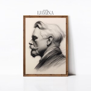 May include: A black and white charcoal drawing of a man's face in profile, framed in a light wood frame. The drawing is titled "GALERIA LUMINA".