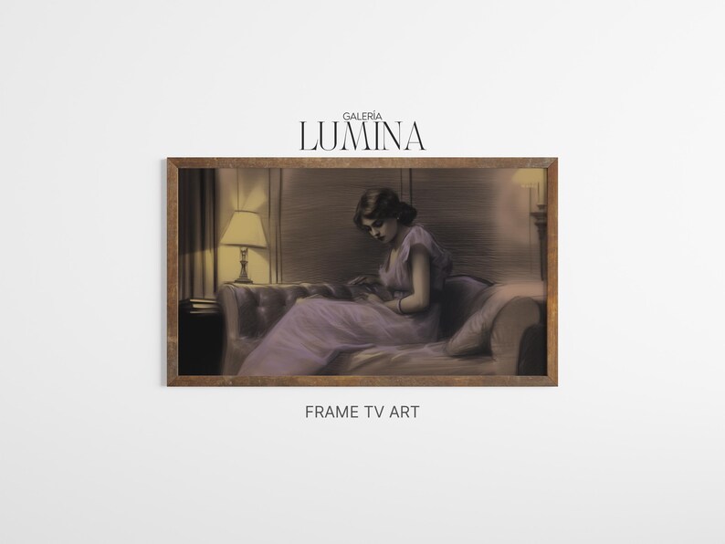 May include: A framed artwork featuring a woman in a lavender dress seated on a sofa, reading. The artwork has a vintage aesthetic, with soft lighting and a warm color palette. The frame is a dark wood color. The text "GALERIA LUMINA" is at the top.