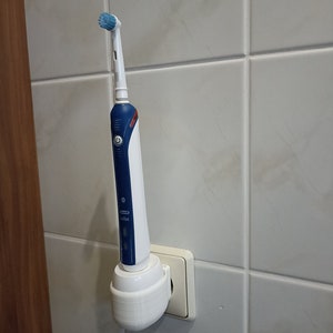 Oral B electric toothbrush holder charging station wall socket image 6