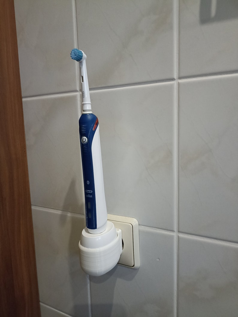 Oral B electric toothbrush holder charging station wall socket image 6