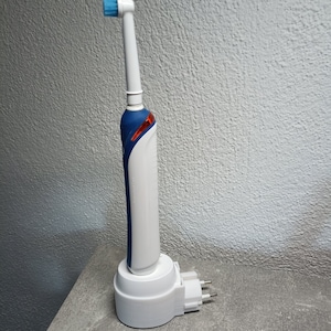 Oral B electric toothbrush holder charging station wall socket image 4